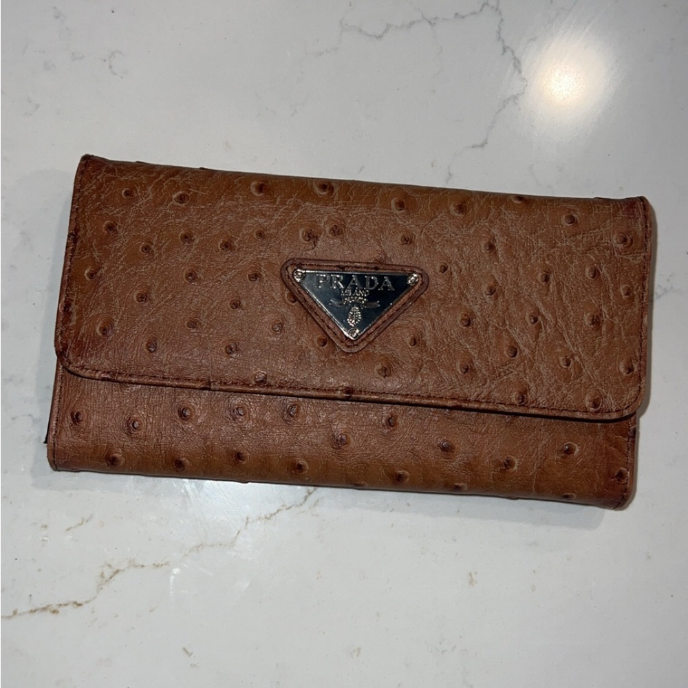 brown leather prada wallet! small tear in top right corner, see picture!